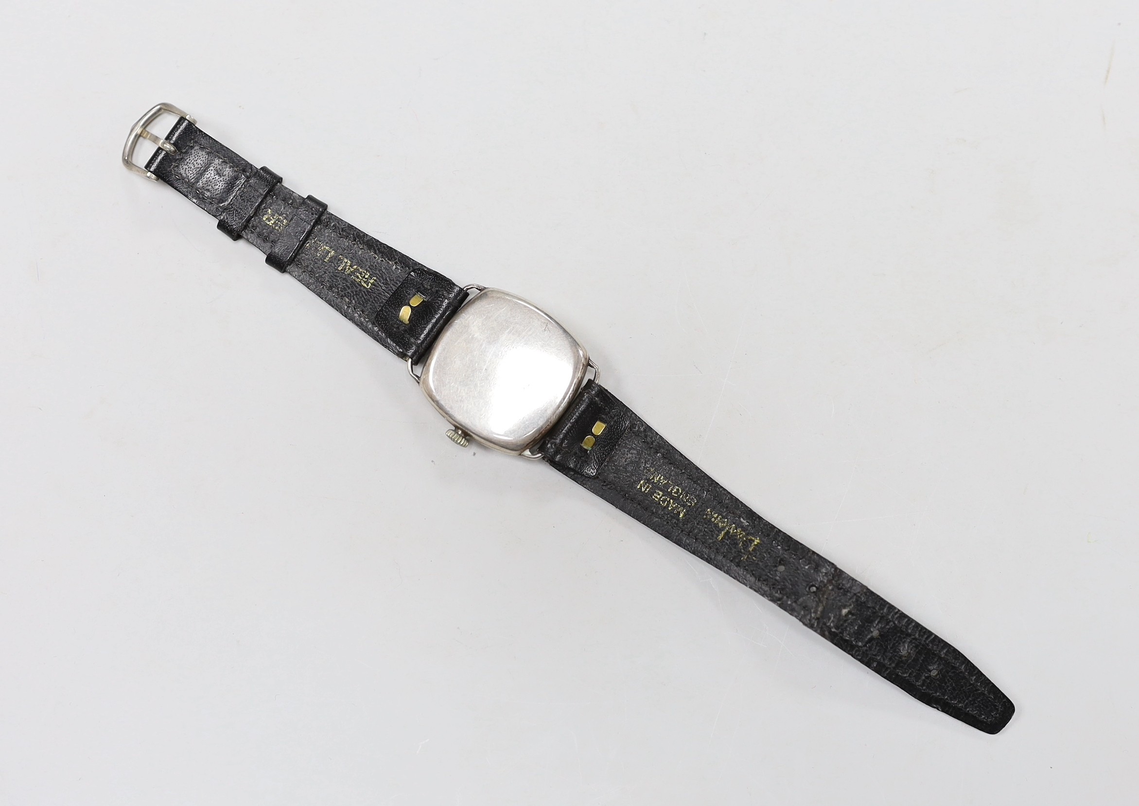 A gentleman's 1920's silver manual wind wrist watch, with Arabic dial and subsidiary seconds, on a later leather strap.